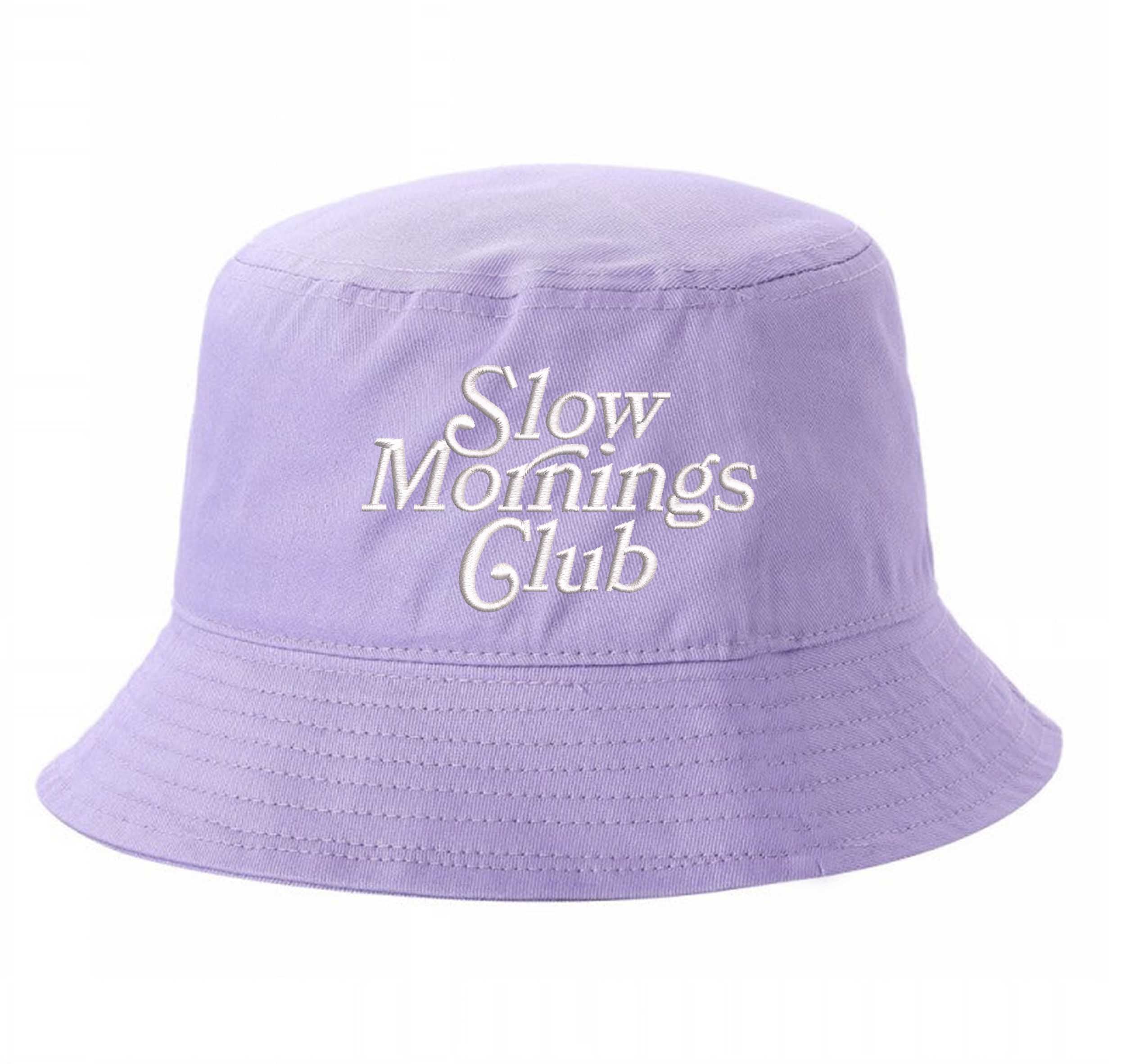 Lilac Front view of a classic cotton bucket hat featuring the phrase "Slow Morning" in high-density script embroidery. - DSY Lifestyle