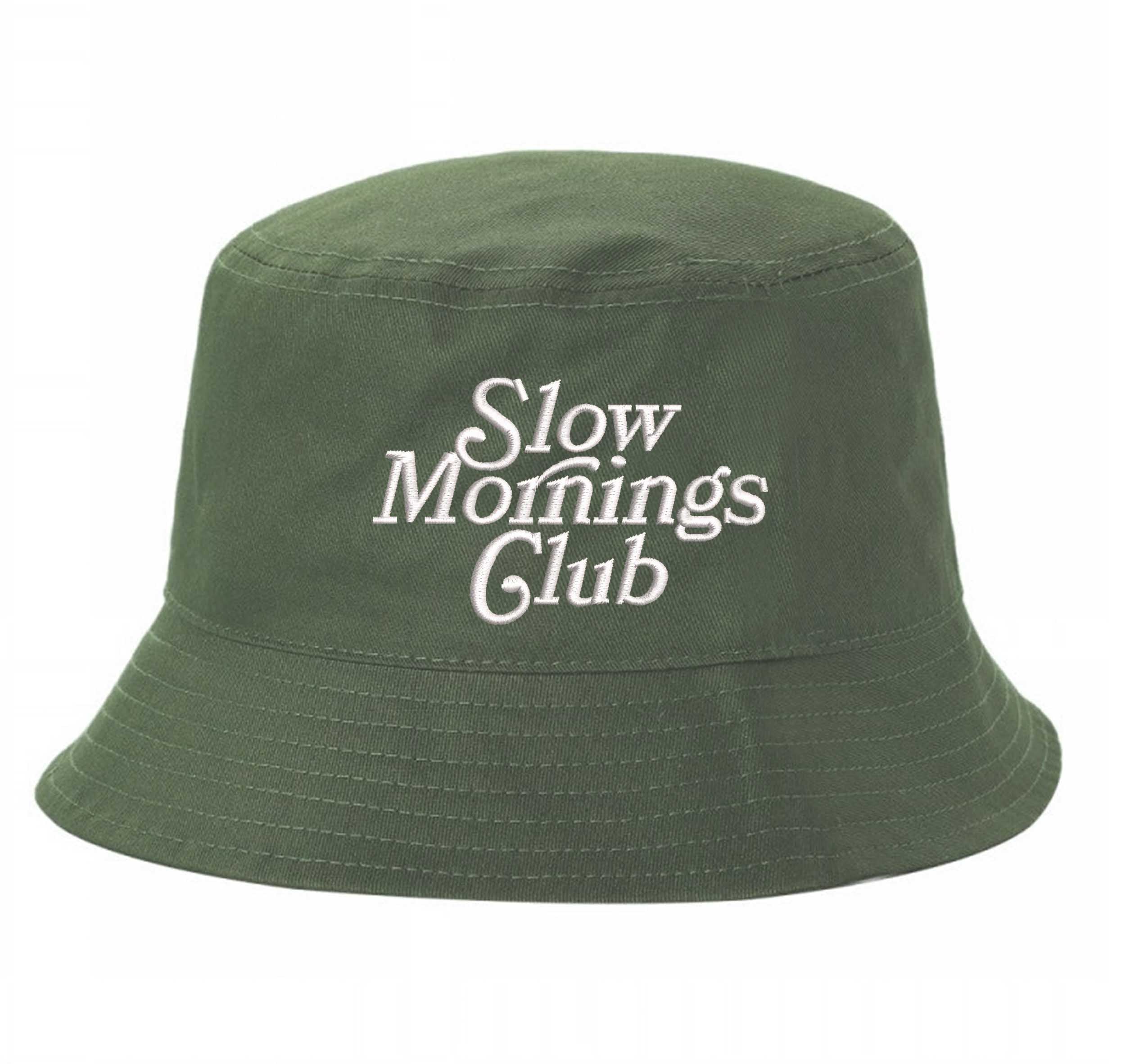 Olive Green Front view of a classic cotton bucket hat featuring the phrase "Slow Morning" in high-density script embroidery. - DSY Lifestyle