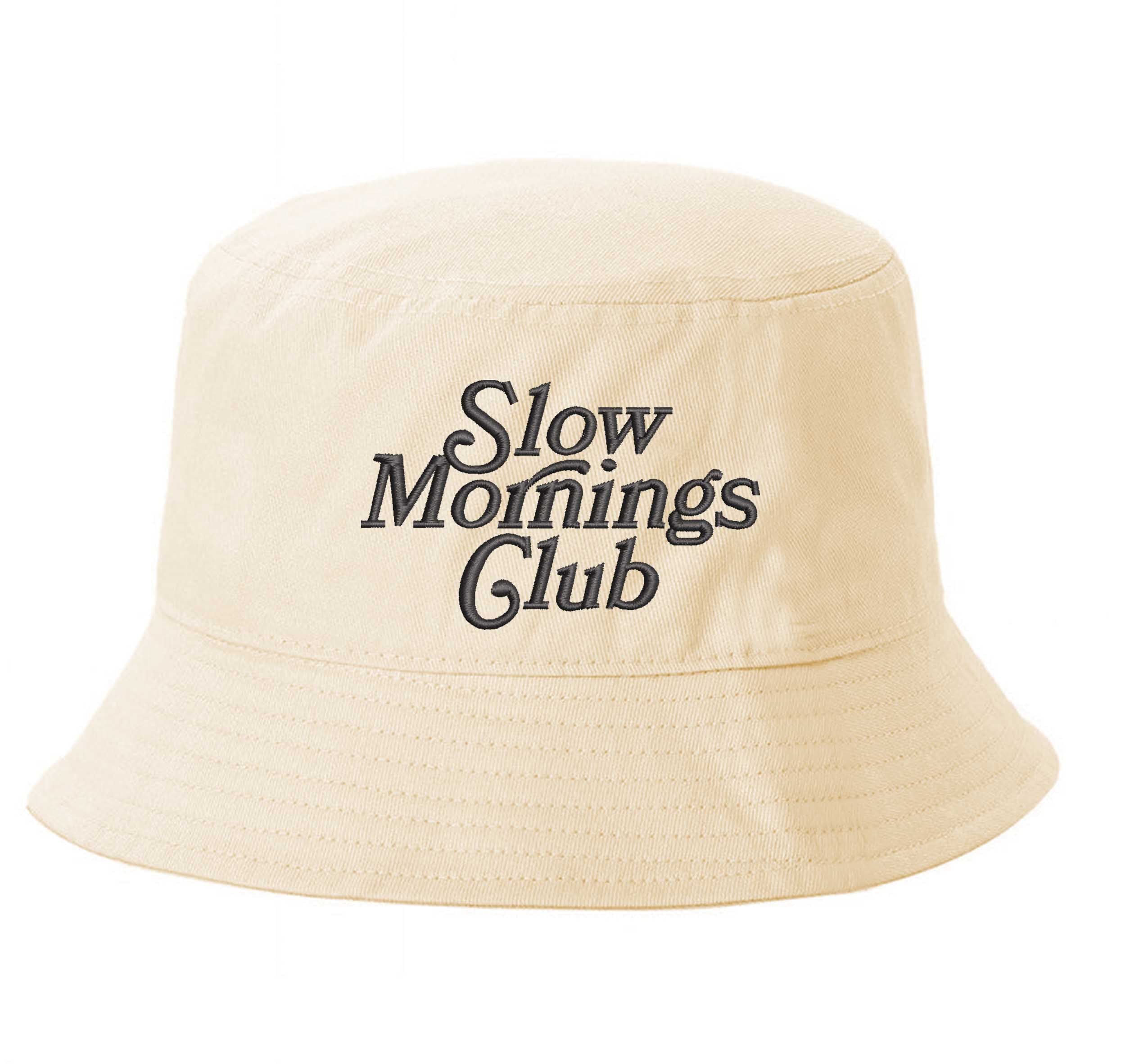 Stone Front view of a classic cotton bucket hat featuring the phrase "Slow Morning" in high-density script embroidery. - DSY Lifestyle