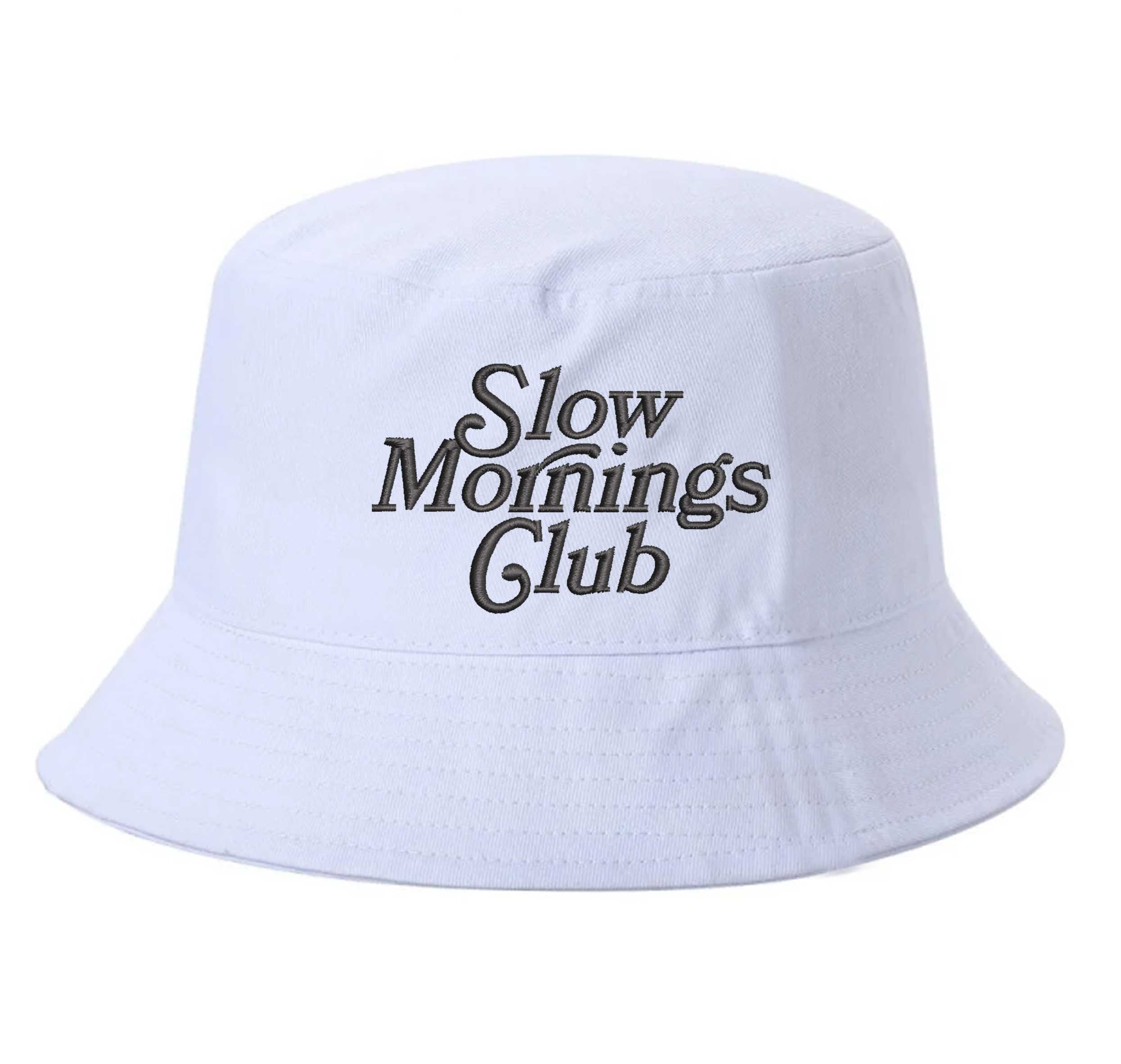 White Front view of a classic cotton bucket hat featuring the phrase "Slow Morning" in high-density script embroidery. - DSY Lifestyle