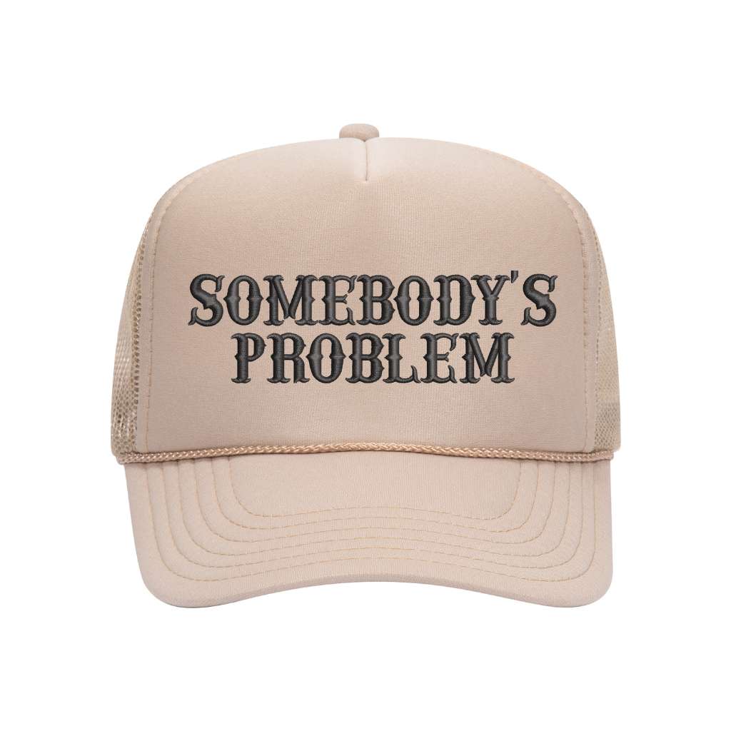 Tan foam trucker hat embroidered with the phrase somebody&