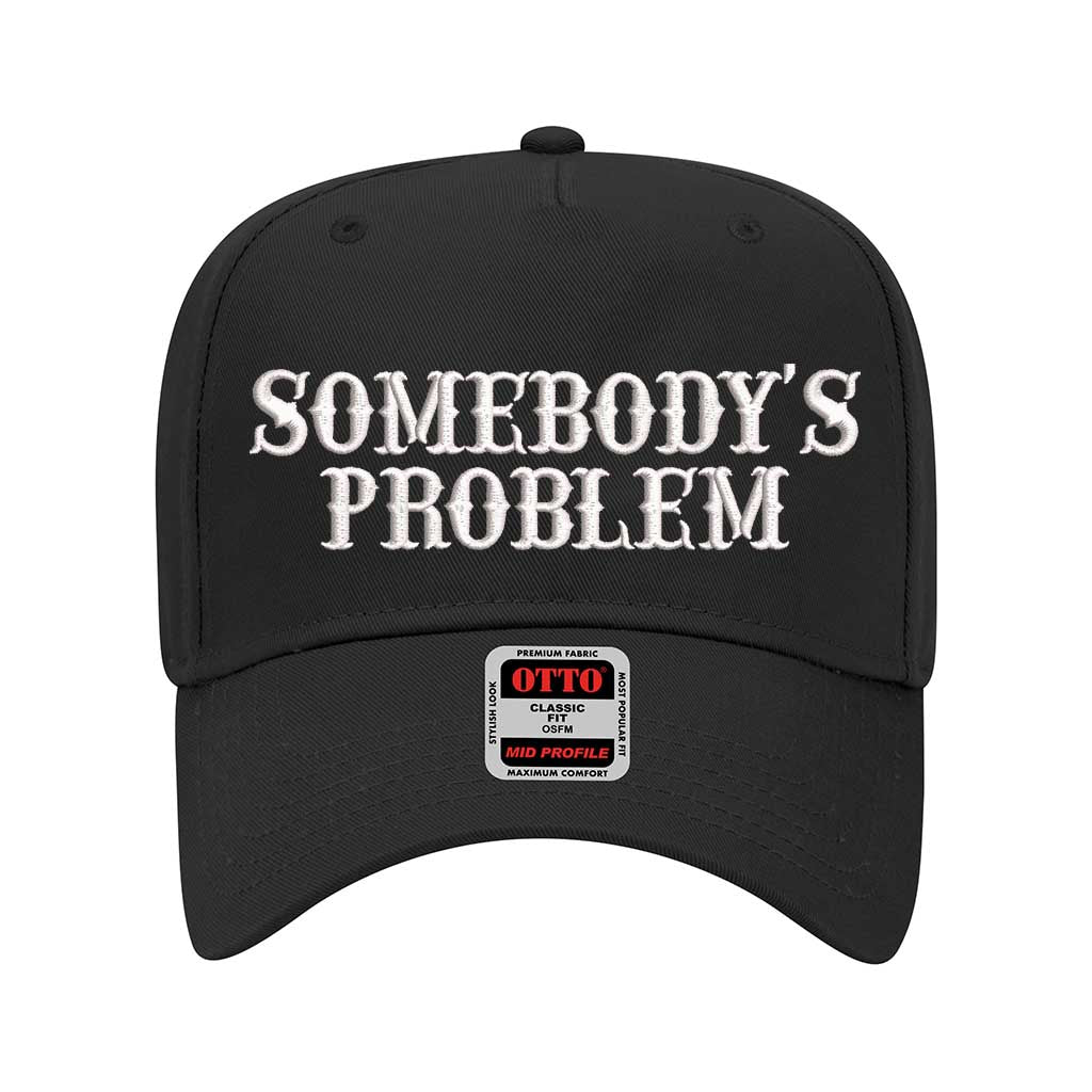 Solid Black 5 panel Somebody’s Problem embroidered dad hat with white front panel, beige brim, bold black text, and adjustable strap. – DSY Lifestyle.