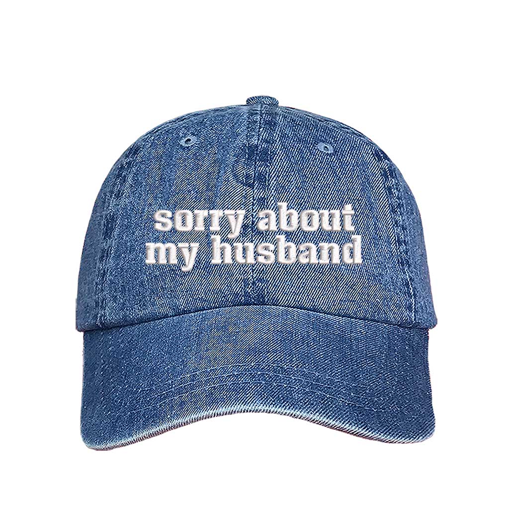 Light Denim Sorry About My Husband Embroidered Baseball Hat in classic cotton dad cap style with curved brim and hook and loop closure. DSY Lifestyle.