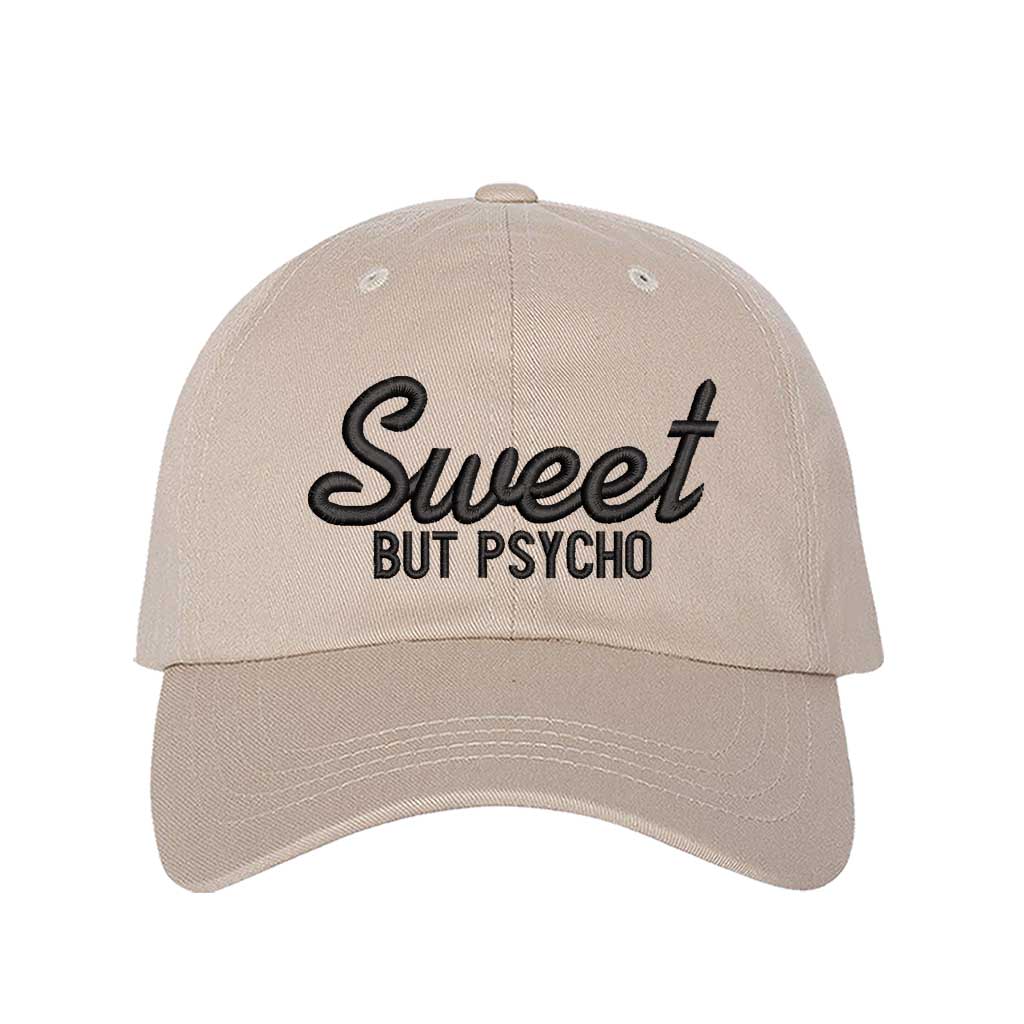 Stone Close-up of a DSY Lifestyle baseball hat with "Sweet But Psycho" embroidered in a clean, modern font; a funny statement gift for her.