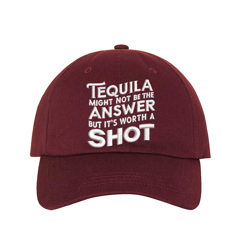 Burgundy Cotton baseball hat with “Tequila Might Not Be The Answer But It’s Worth A Shot” embroidered on the front, pre-curved brim, and adjustable strap. DSY Lifestyle.