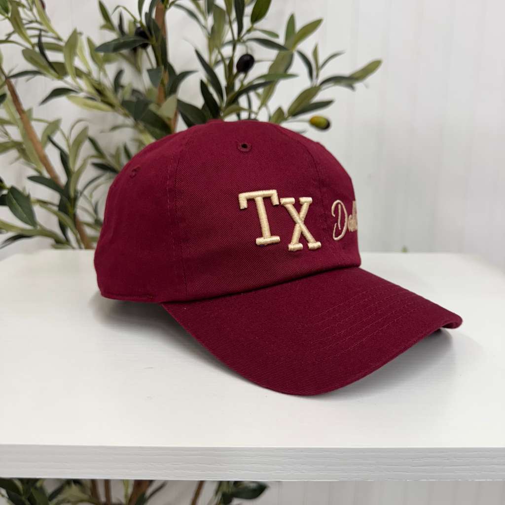 Burgundy with gold thread TX 3D Dallas embroidered baseball cap with bold lettering, a curved brim, and adjustable fit. A stylish and versatile hat for everyday wear - DSY Lifestyle