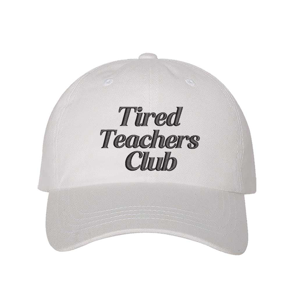 White DSY Lifestyle cotton baseball hat featuring the phrase Tired Teacher Club in bold, detailed professional embroidery. - DSY Lifestyle