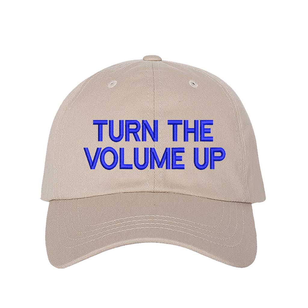 Stone with blue thread Turn Up The Volume Embroidered Baseball Hat featuring classic design, music-inspired embroidery, and adjustable hook and loop closure – DSY Lifestyle