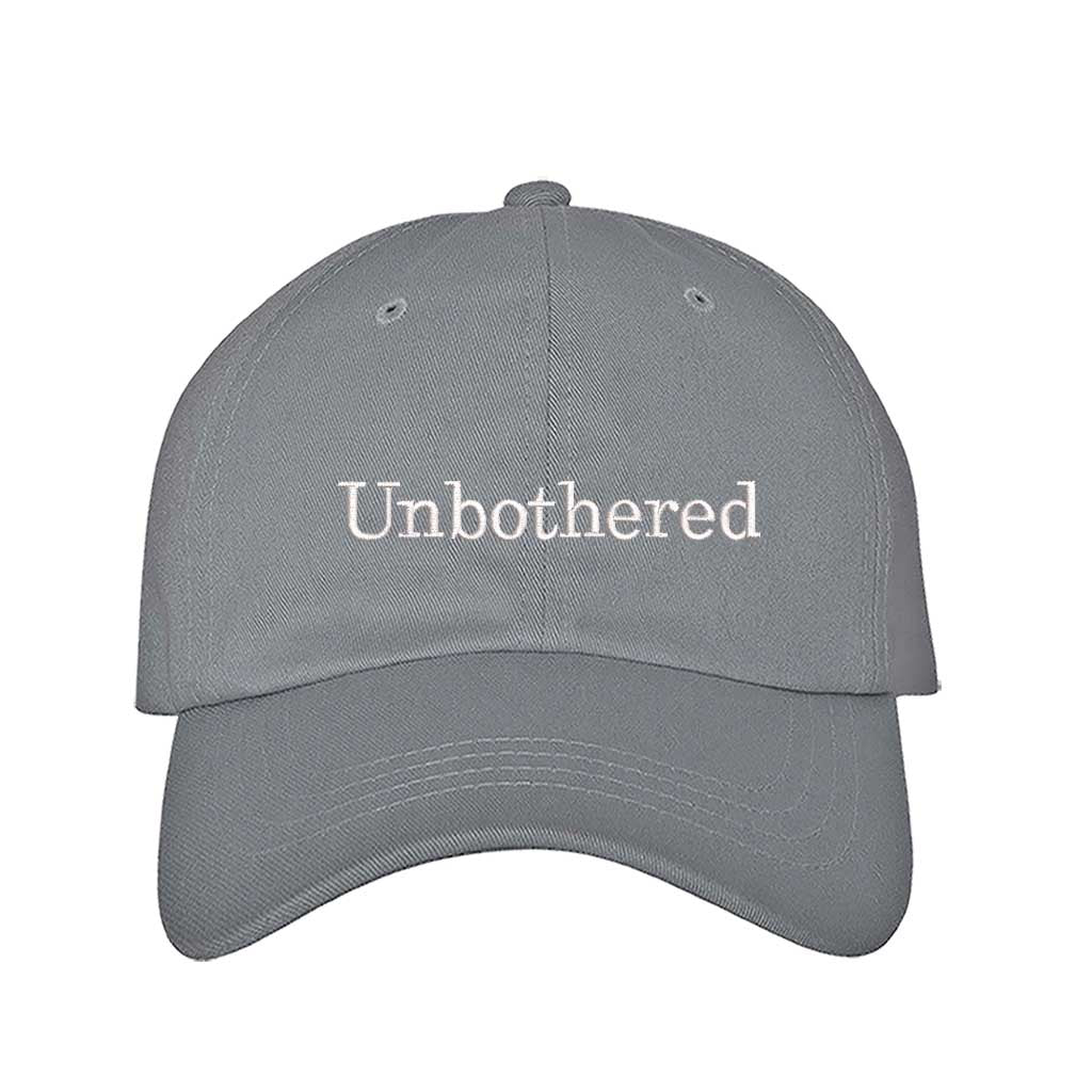 Gray Front view of a classic baseball hat featuring "Unbothered" in high-density script embroidery on the center crown. - DSY Lifestyle