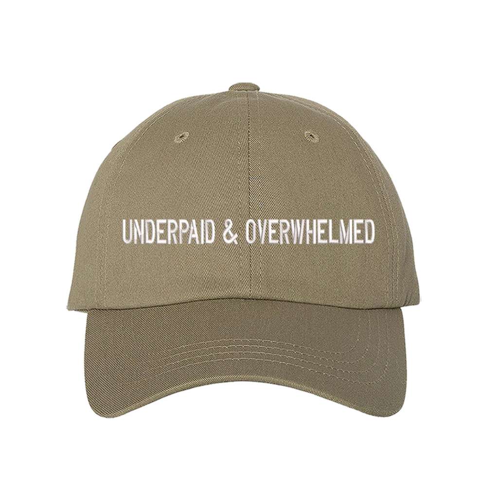 Khaki baseball hat with the phrase underpaid & overwhelmed embroidered on it-DSY Lifestyle