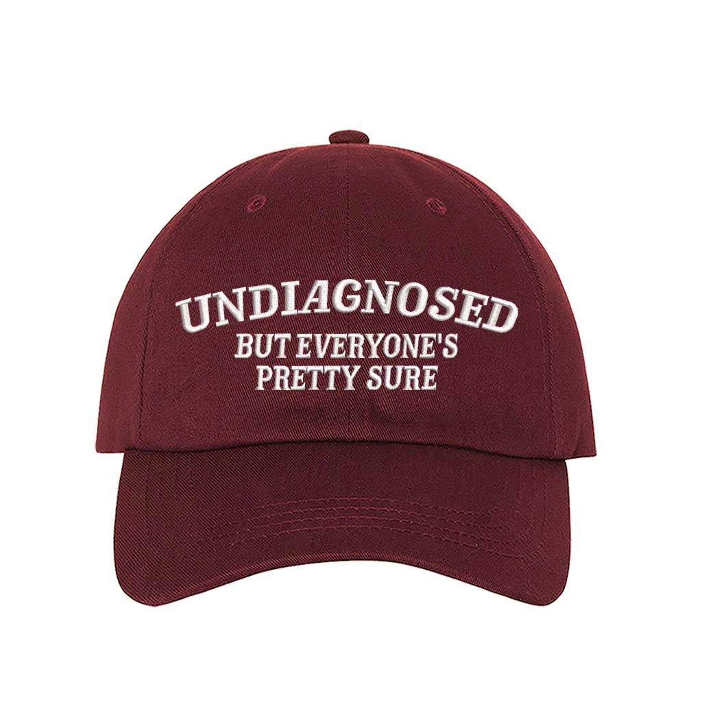 Burgundy Undiagnosed But Everyone Is Pretty Sure embroidered baseball hat with bold stitching and relatable humor – DSY Lifestyle