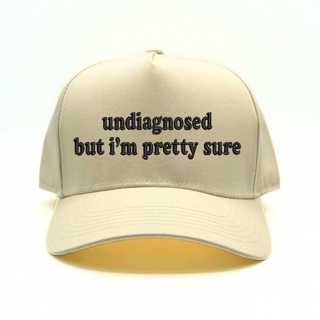 Natural baseball hat with natural colored bill with the phrase undiagnosed but im pretty sure in black embroidery-DSY Lifestyle