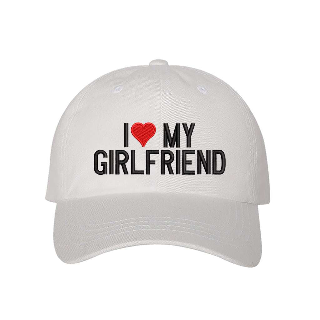 White baseball hat embroidered with the phrase i love my girlfriend but love is a heart- DSY Lifestyle