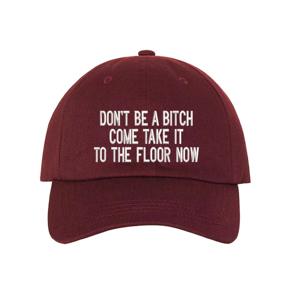 Burgundy baseball hat embroidered with the phrase Don&