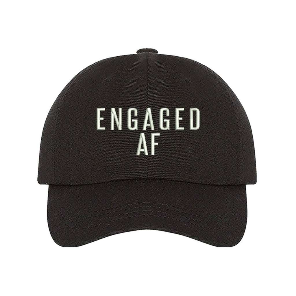 Black trendy embroidered baseball hat with Engaged AF text, perfect for newly engaged brides-to-be celebrating their upcoming wedding - DSY Lifestyle