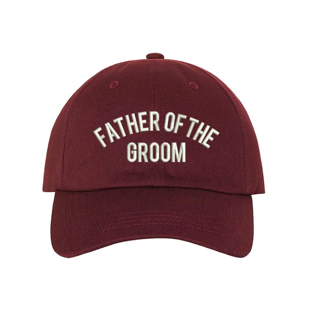 Burgundy sleek embroidered baseball hat featuring Father of the Groom text, designed for proud dads celebrating their son&