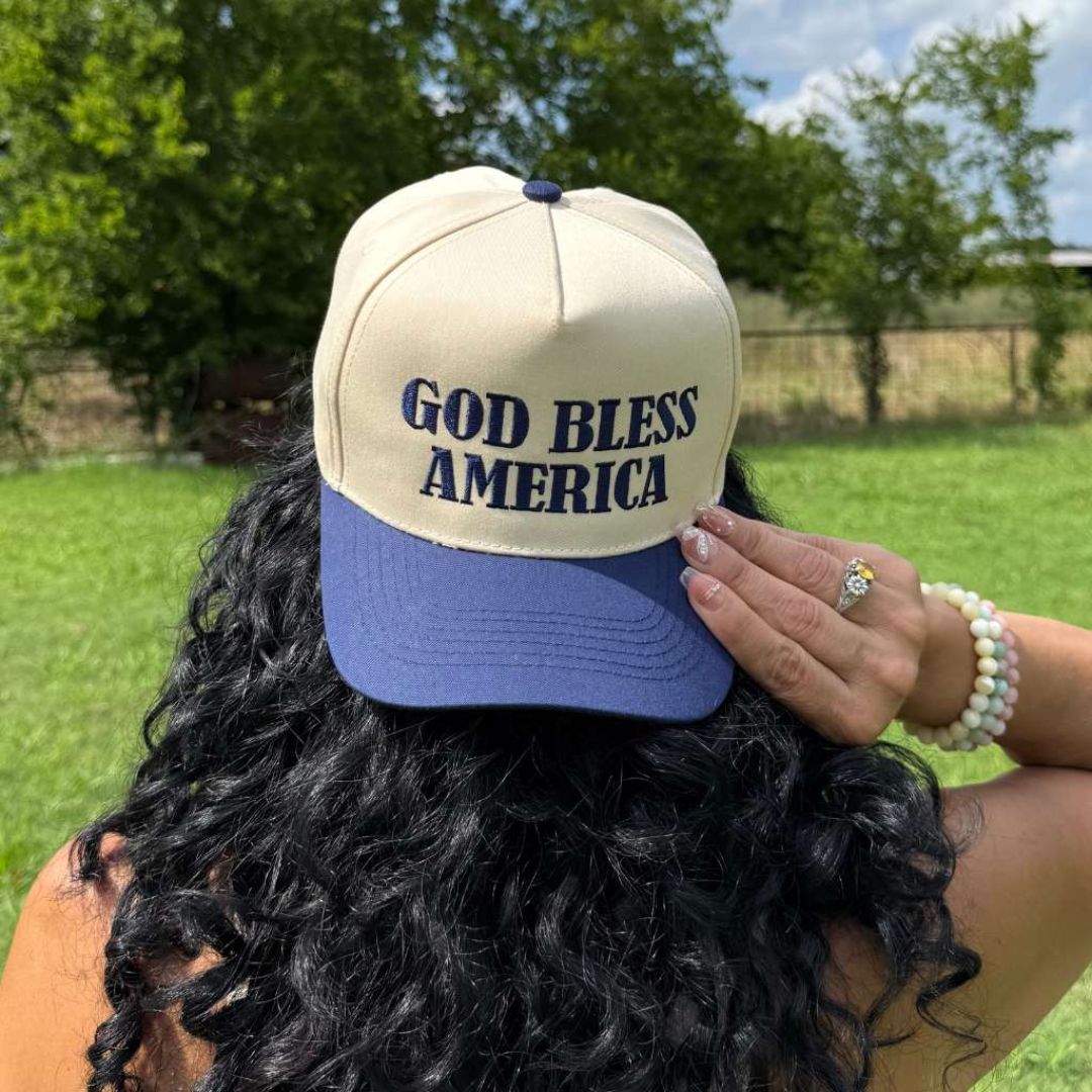 Natural Navy Two-tone 5-panel baseball hat with "God Bless America" embroidered on the front, structured crown and snapback closure โ DSY Lifestyle