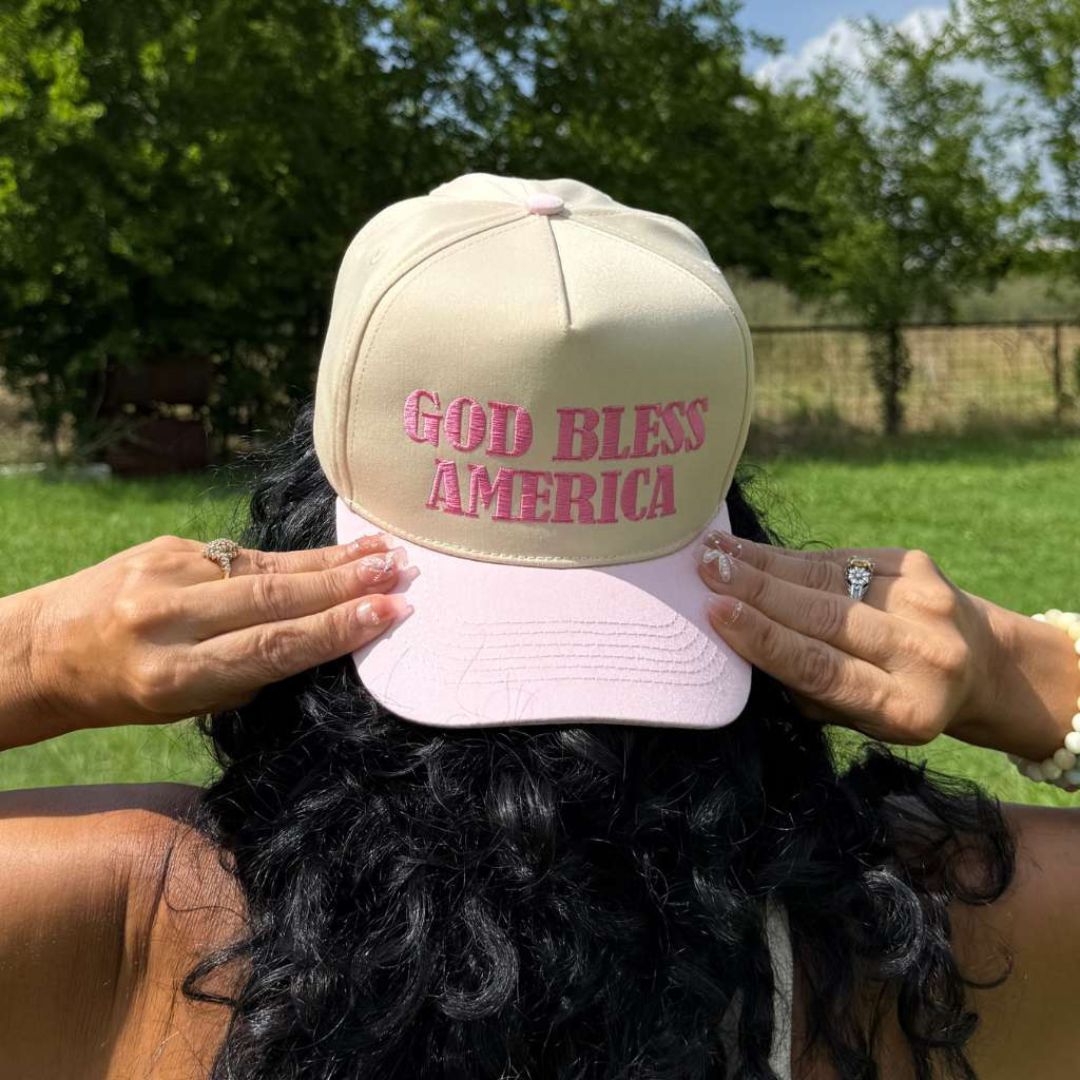 Natural Pink Two-tone 5-panel baseball hat with "God Bless America" embroidered on the front, structured crown and snapback closure โ DSY Lifestyle