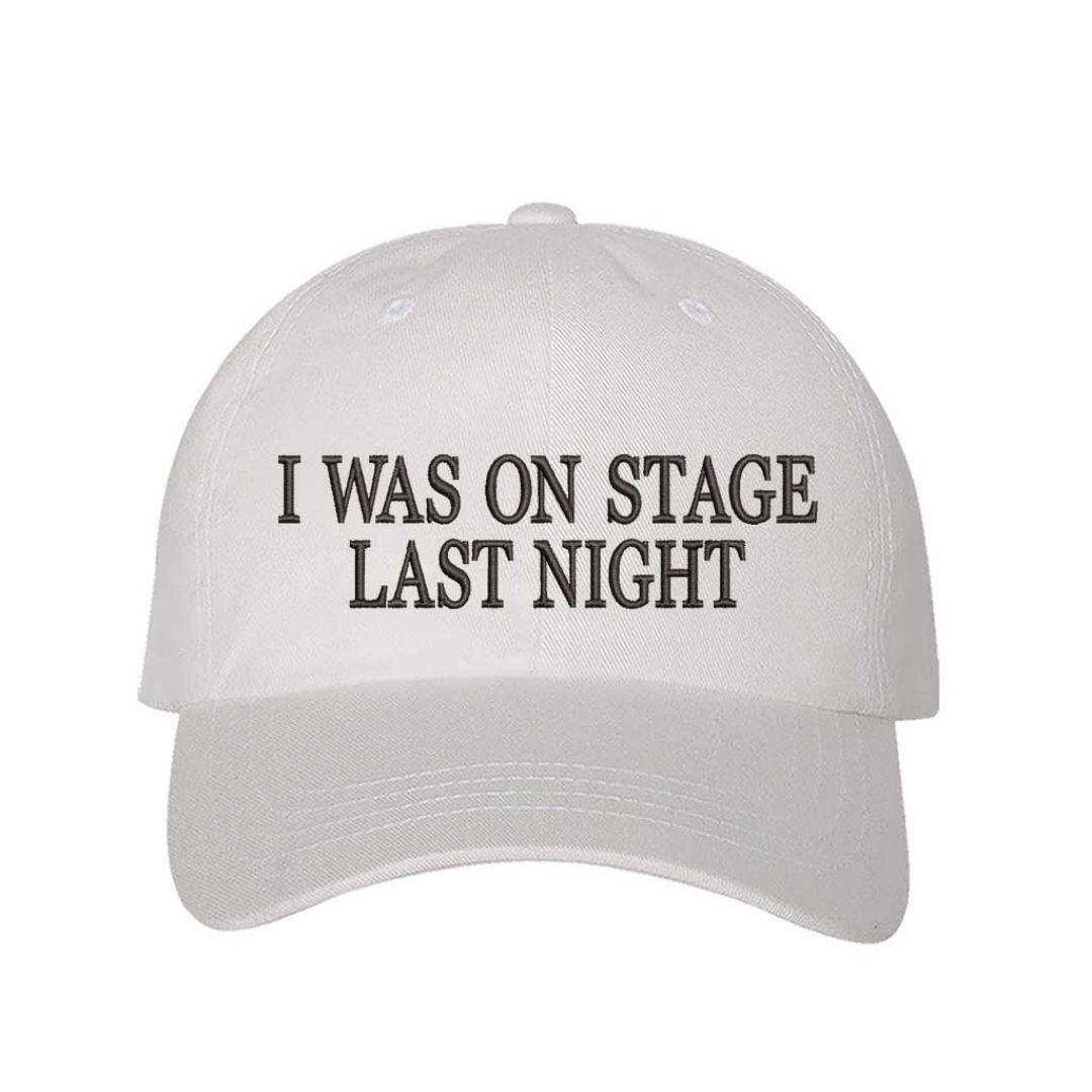 White embroidered baseball hat with black text reading βI Was On Stage Last Nightβ β ideal for performers and creatives. - DSY Lifestyle