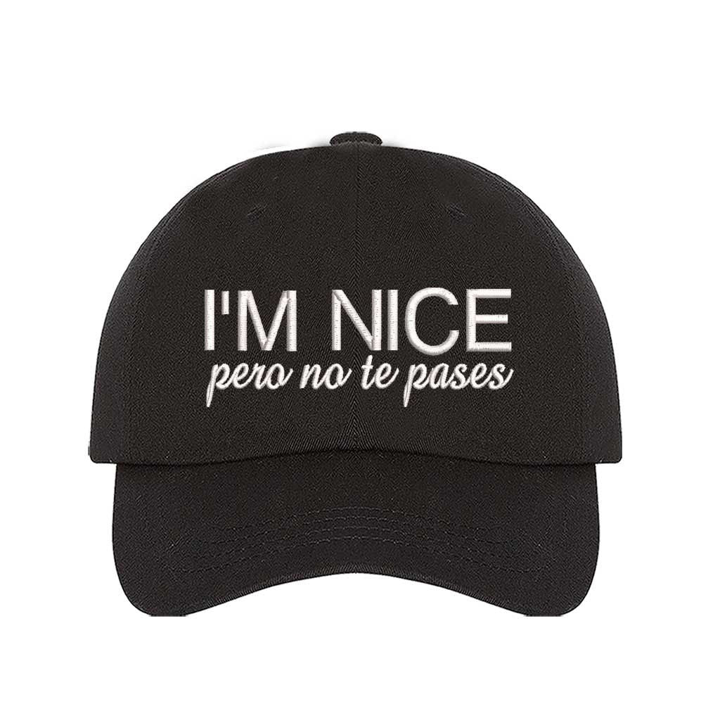 Black I’m Nice Pero No Te Pases Embroidered Baseball Hat in soft cotton with curved brim and hook and loop closure. DSY Lifestyle.