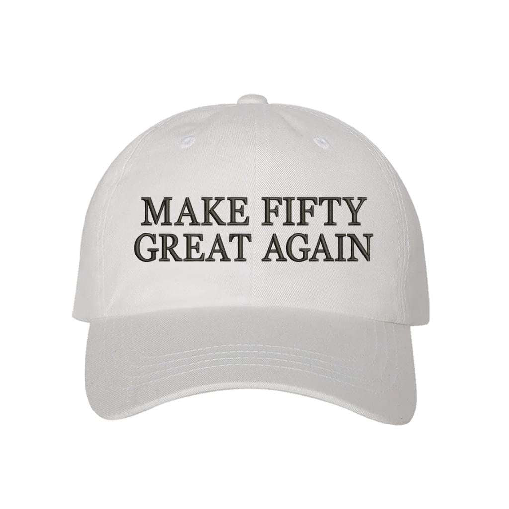White stylish baseball hat with Make Fifty Great Again embroidered on the front, featuring an adjustable strap and soft cotton fabric for a comfortable and classic fit - DSY Lifestyle