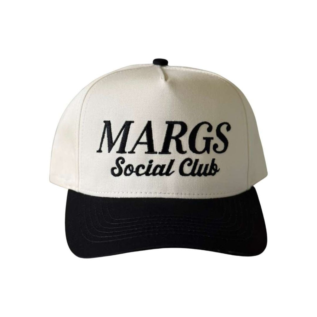 Natural BlackTwo-tone embroidered trucker baseball hat with “Margs Social Club” stitched on front, adjustable snapback closure – DSY Lifestyle