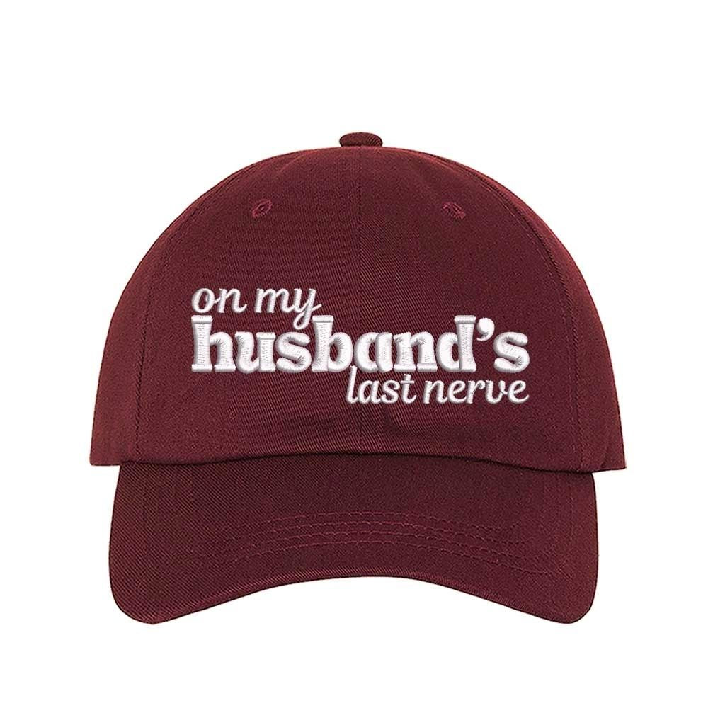 Burgundy On My Husband’s Last Nerve Embroidered Baseball Hat in cotton with curved brim and adjustable strap closure. DSY Lifestyle.