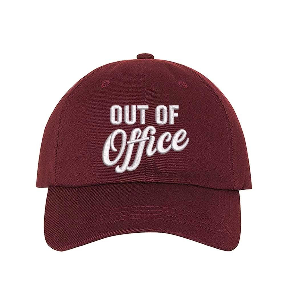 Burgundy Out of Office Embroidered Baseball Hat in breathable cotton with pre-curved brim and adjustable hook and loop closure, styled for vacation or casual wear. DSY Lifestyle.