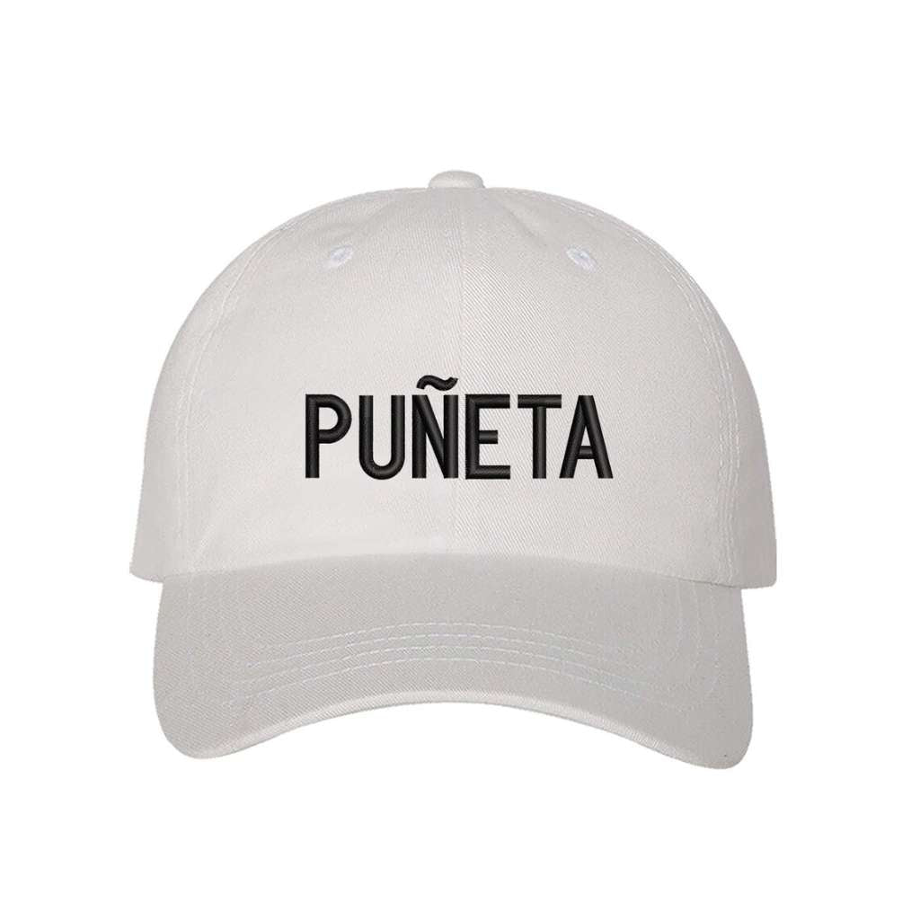 White embroidered baseball hat featuring the Puerto Rican slang Puñeta! in bold lettering, adding a fun and expressive touch to any outfit - DSY Lifestyle