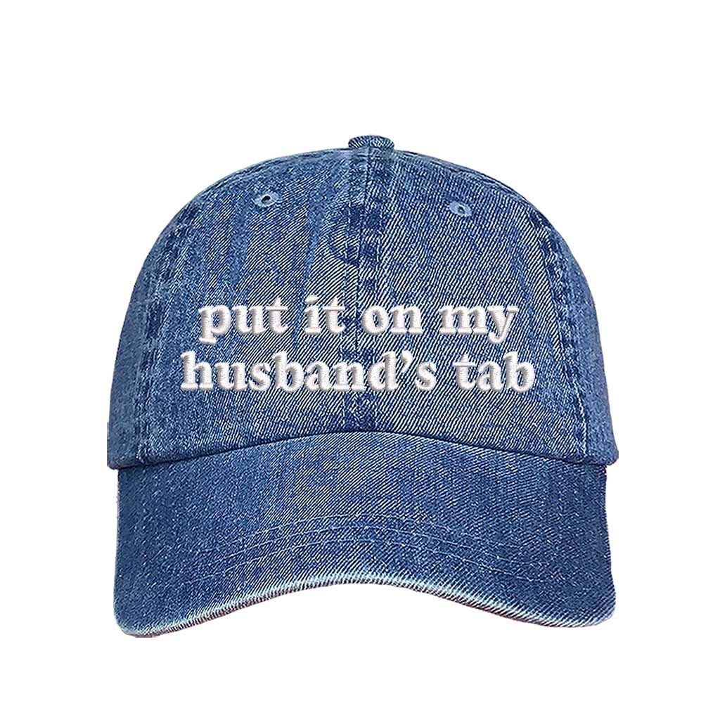 Light Denim Put It on My Husband’s Tab Embroidered Baseball Hat in soft cotton with curved brim and adjustable back strap, perfect for vacations and girls’ nights. DSY Lifestyle.