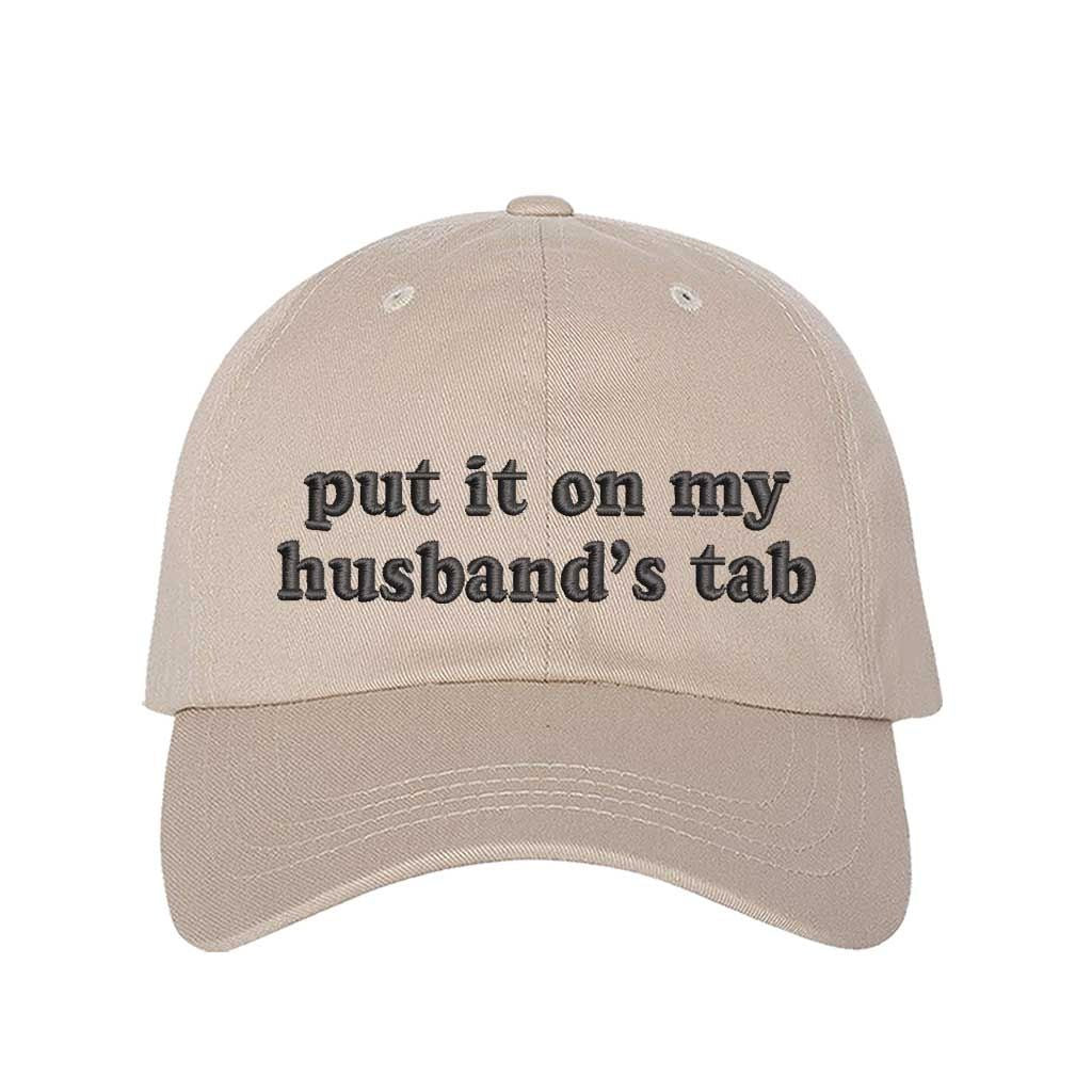 Stone Put It on My Husband’s Tab Embroidered Baseball Hat in soft cotton with curved brim and adjustable back strap, perfect for vacations and girls’ nights. DSY Lifestyle.
