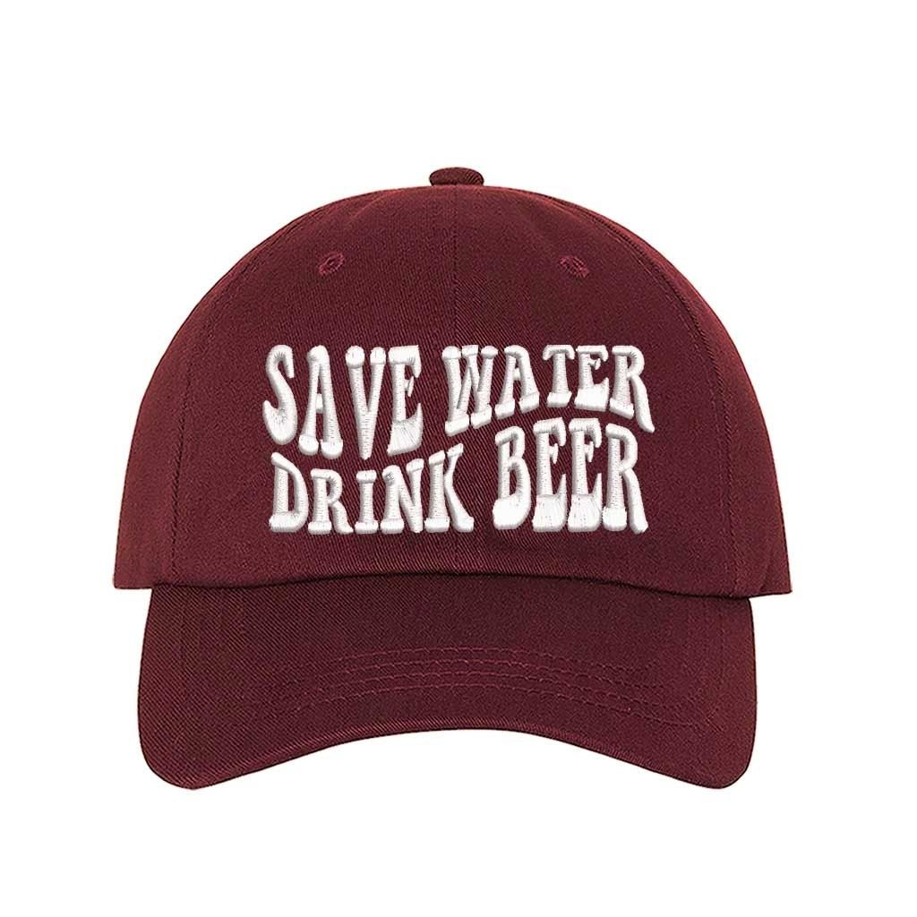 Burgundy Save Water Drink Beer Embroidered Baseball Hat in classic cotton with curved brim and adjustable hook and loop closure, perfect for beer lovers. DSY Lifestyle.