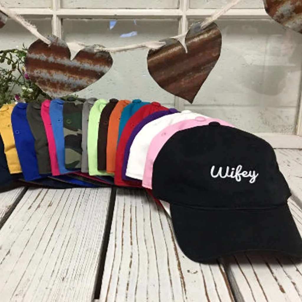 Multi-colored row of classic embroidered baseball hats with Wifey text, perfect for brides, newlyweds, and wives who love a stylish, casual look - DSY Lifestyle