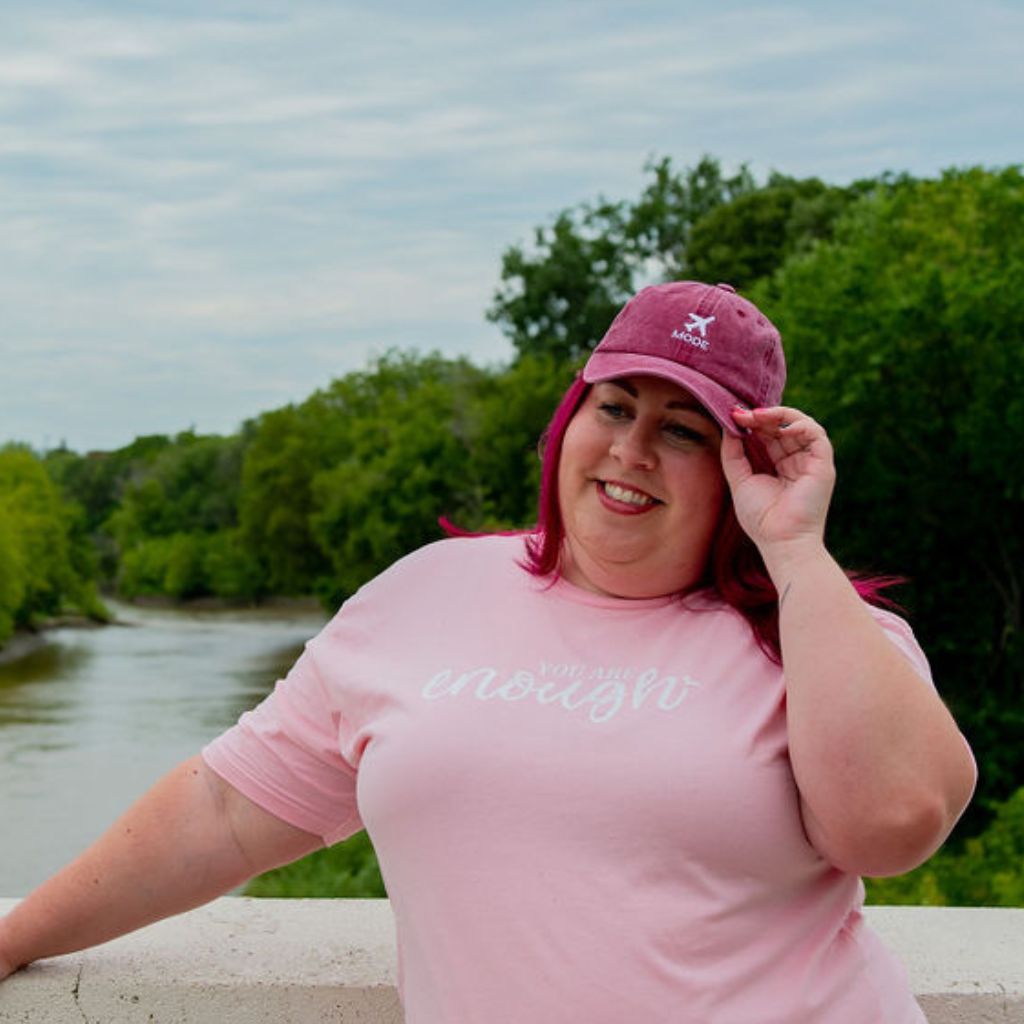 Female wearing a washed wine baseball cap embroidered with Airplane Mode - DSY Lifestyle
