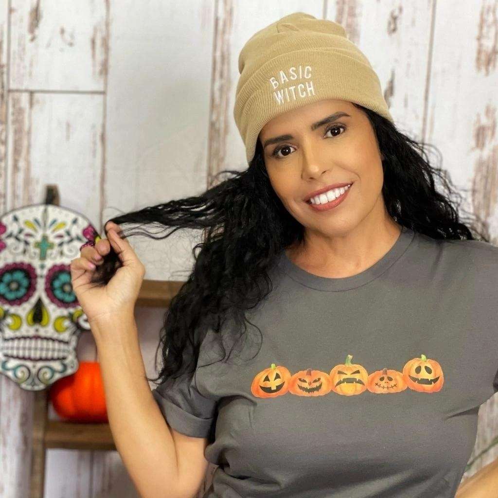 Model wearing tan cuffed beanie with BASIC WITCH embroidered in white - DSY Lifestyle