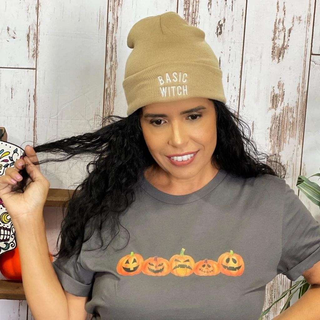 Model wearing tan cuffed beanie with BASIC WITCH embroidered in white - DSY Lifestyle