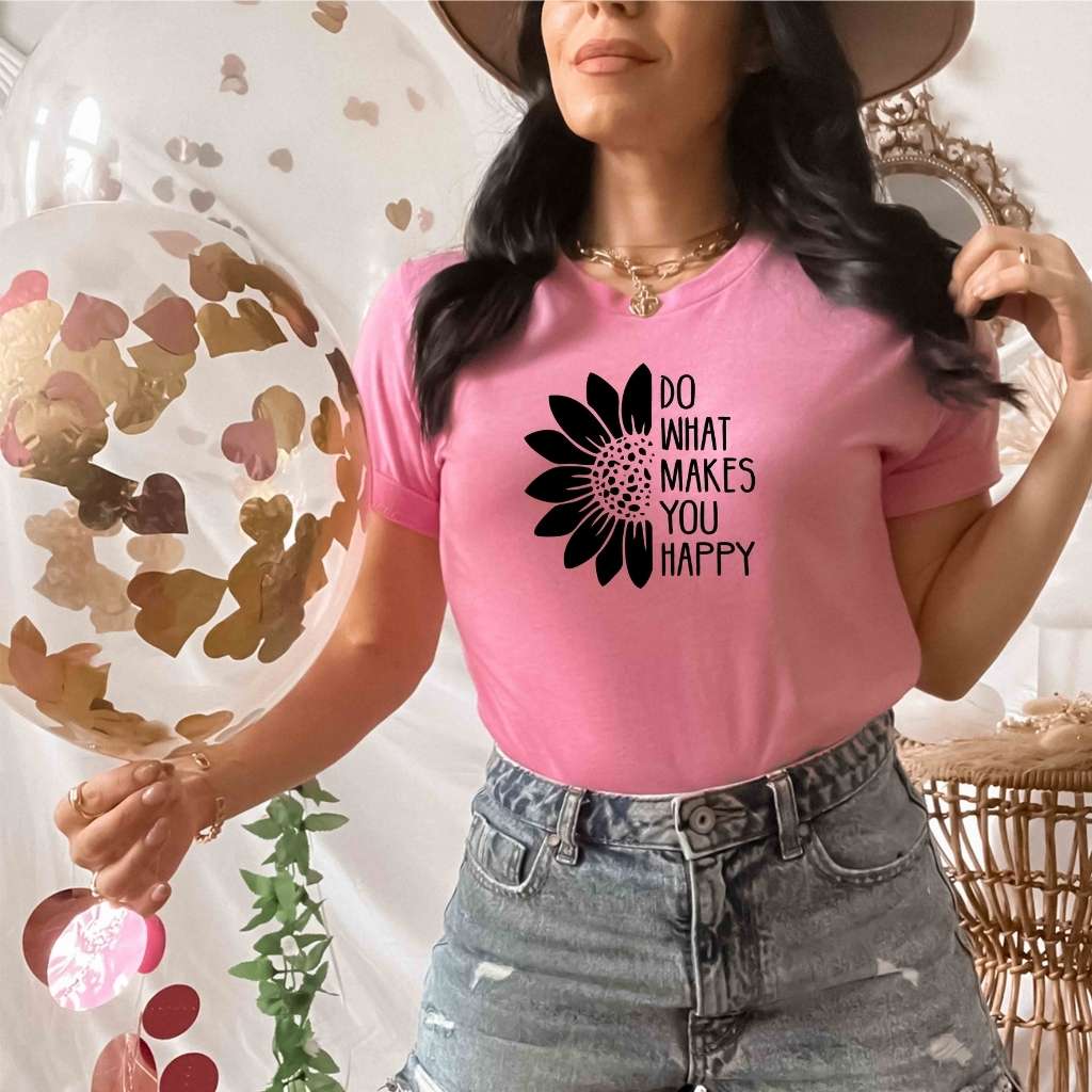 Female wearing a pink tshirt printed with Do what makes you happy - DSY Lifestyle