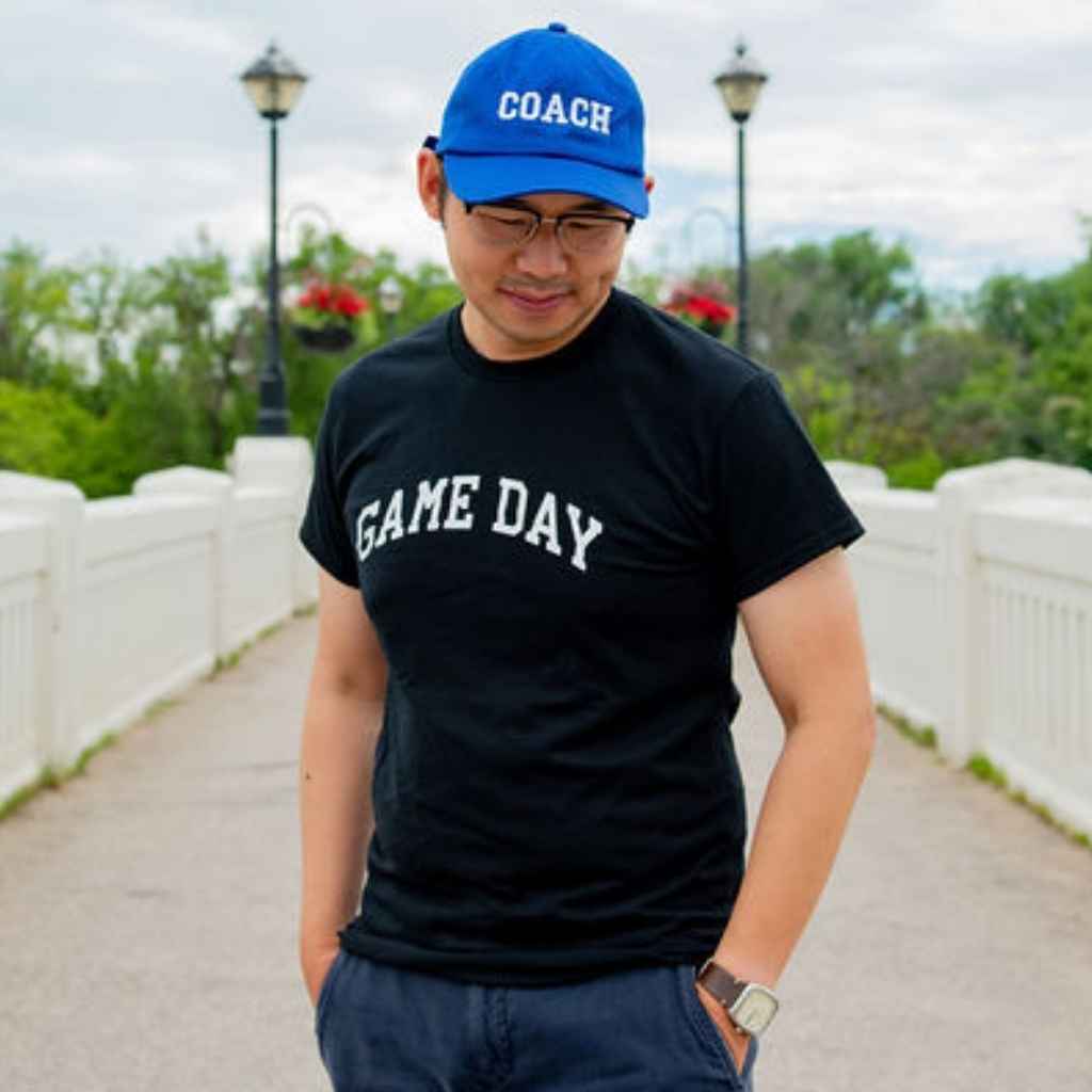 Male wearing a black t-shirt printed with Game Day in white - DSY Lifestyle