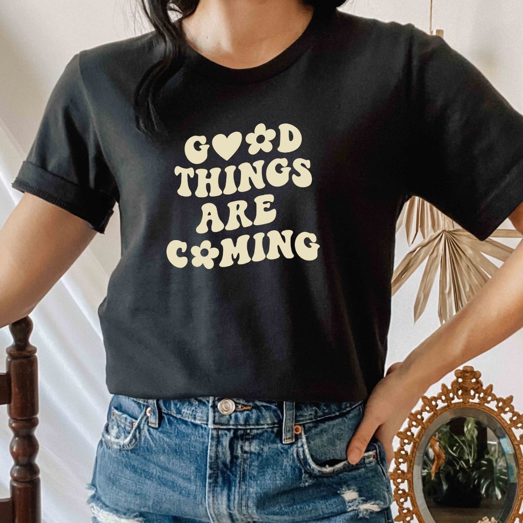 Male wearing a black tshirt printed with Good Things are coming - DSY Lifestyle