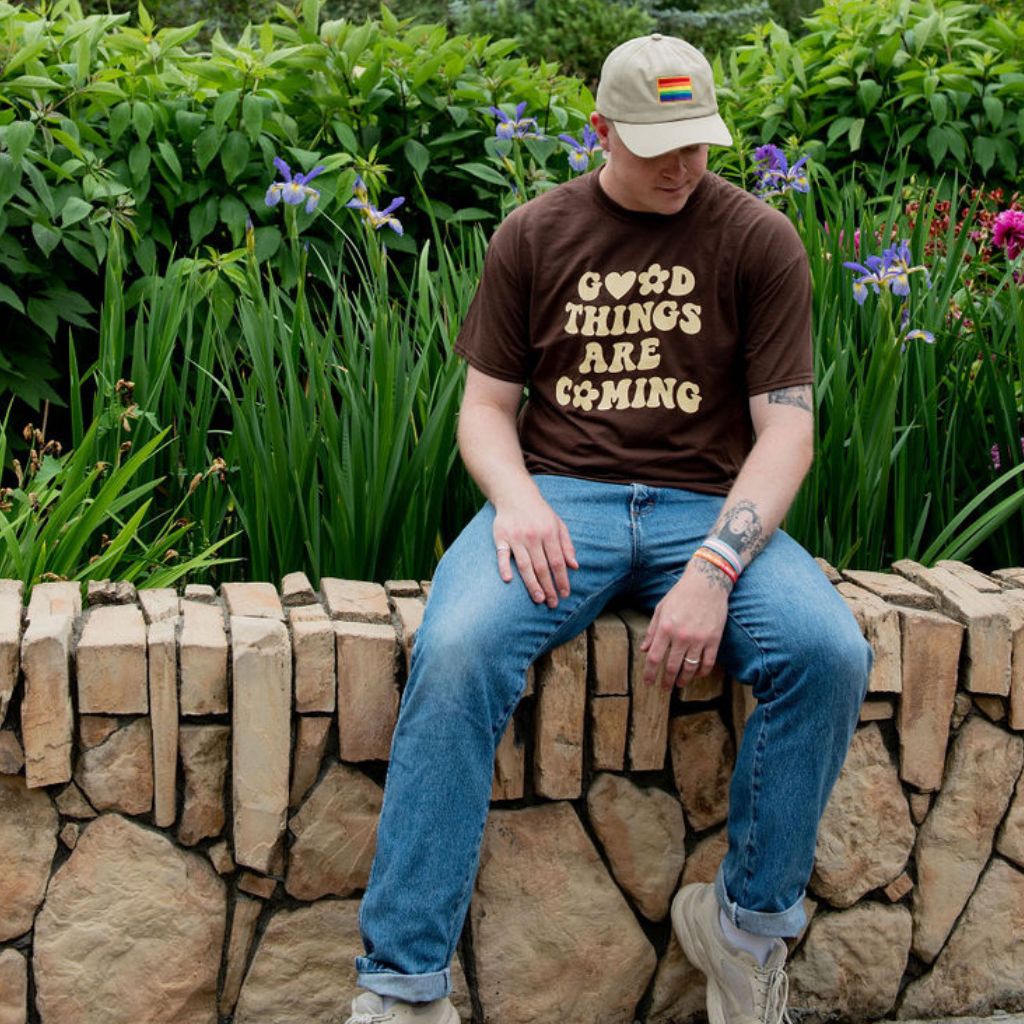 Male wearing a brown tshirt printed with Good Things are coming - DSY Lifestyle