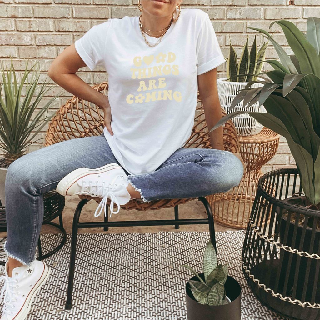 Male wearing a white tshirt printed with Good Things are coming - DSY Lifestyle