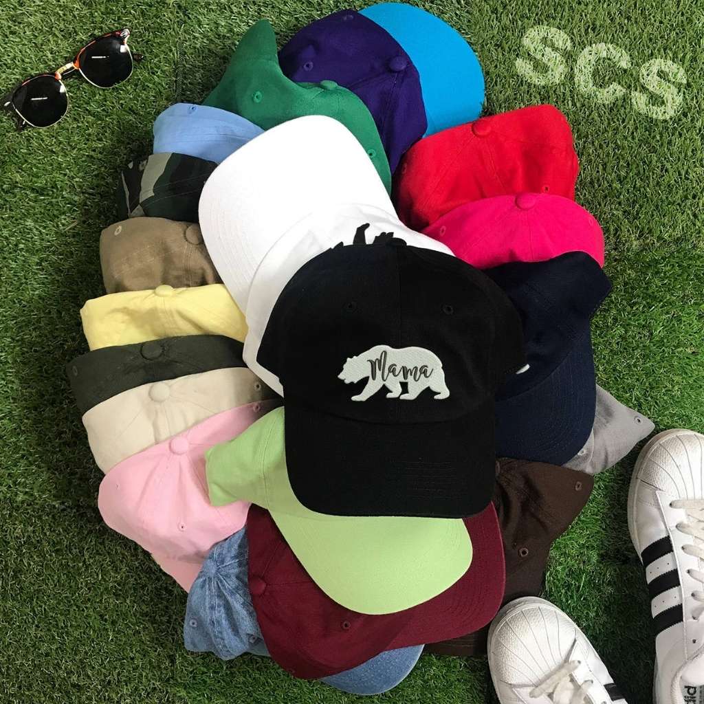 Group photo of baseball hats with white bear outline and Mama embroidered in black - DSY Lifestyle