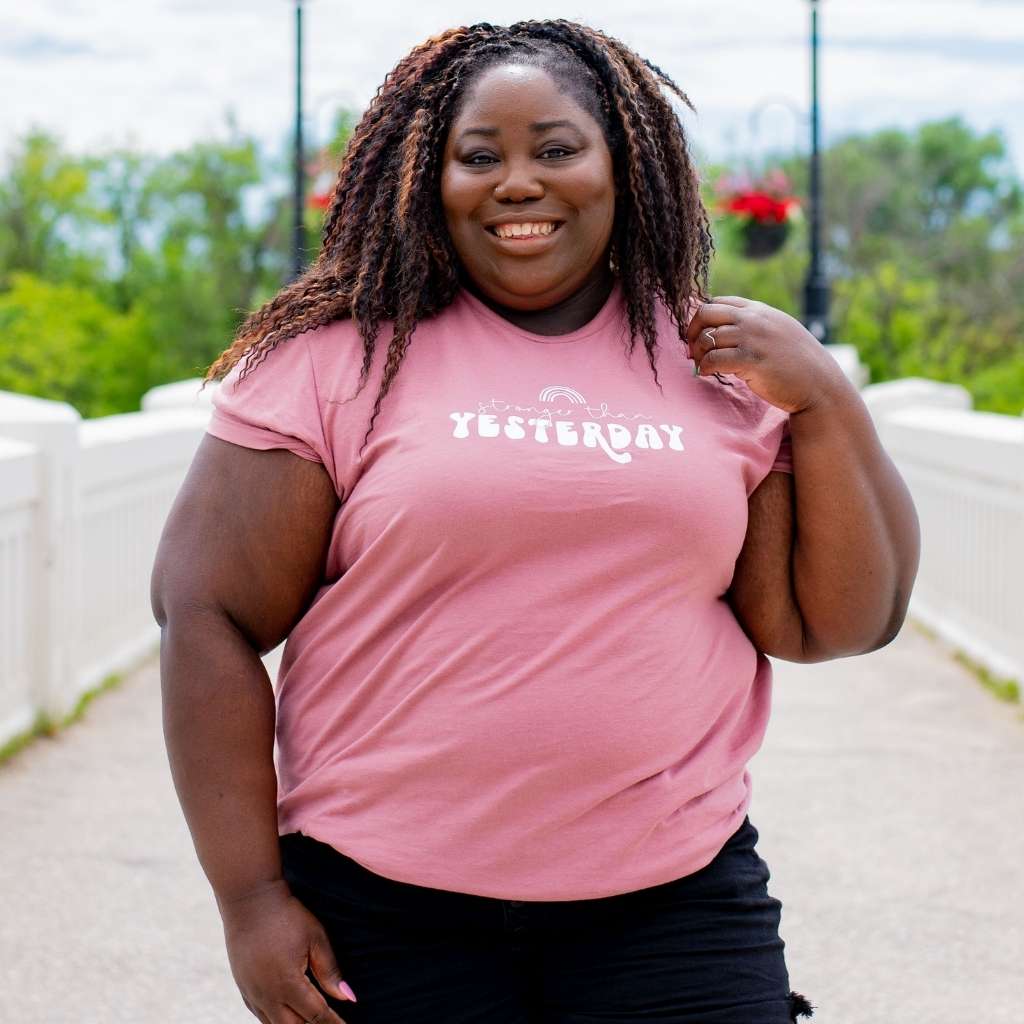 Female wearing a mauve unisex tshirt with Stronger than Yesterday - DSY Lifestyle