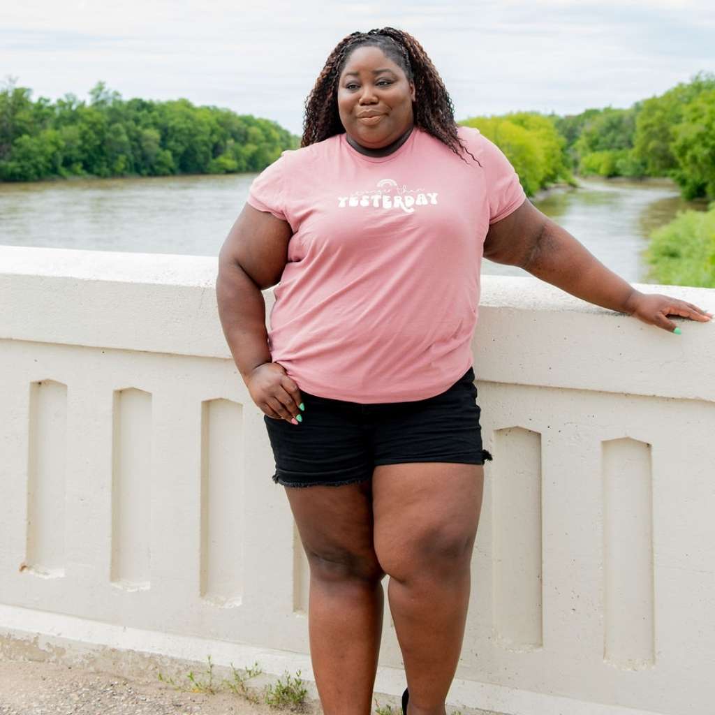 Female wearing a mauve unisex tshirt with Stronger than Yesterday - DSY Lifestyle