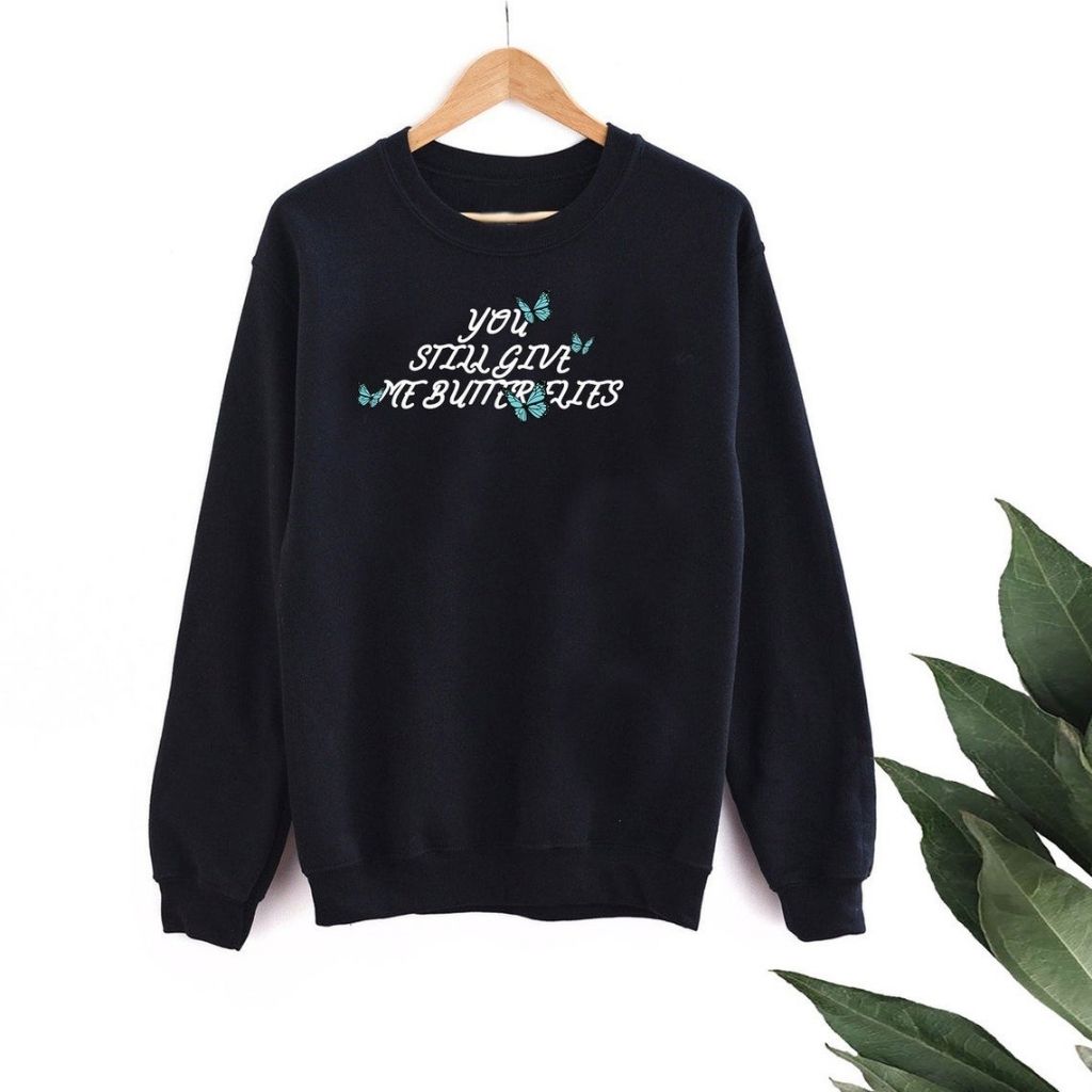 Black sweatshirt with 4 blue butterflies and You still give me butterflies printed in the front in white - DSY Lifestyle
