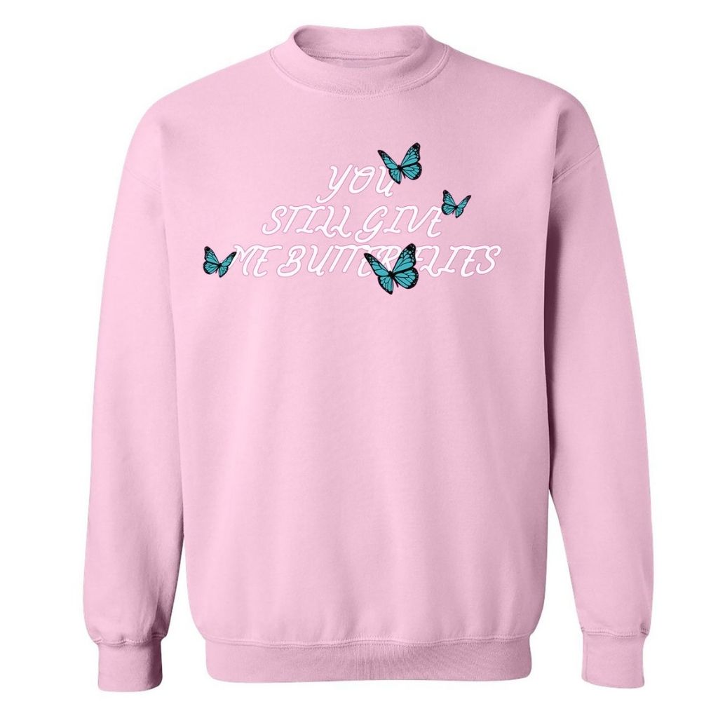 Light Pink sweatshirt with 4 blue butterflies and You still give me butterflies printed in the front in white - DSY Lifestyle
