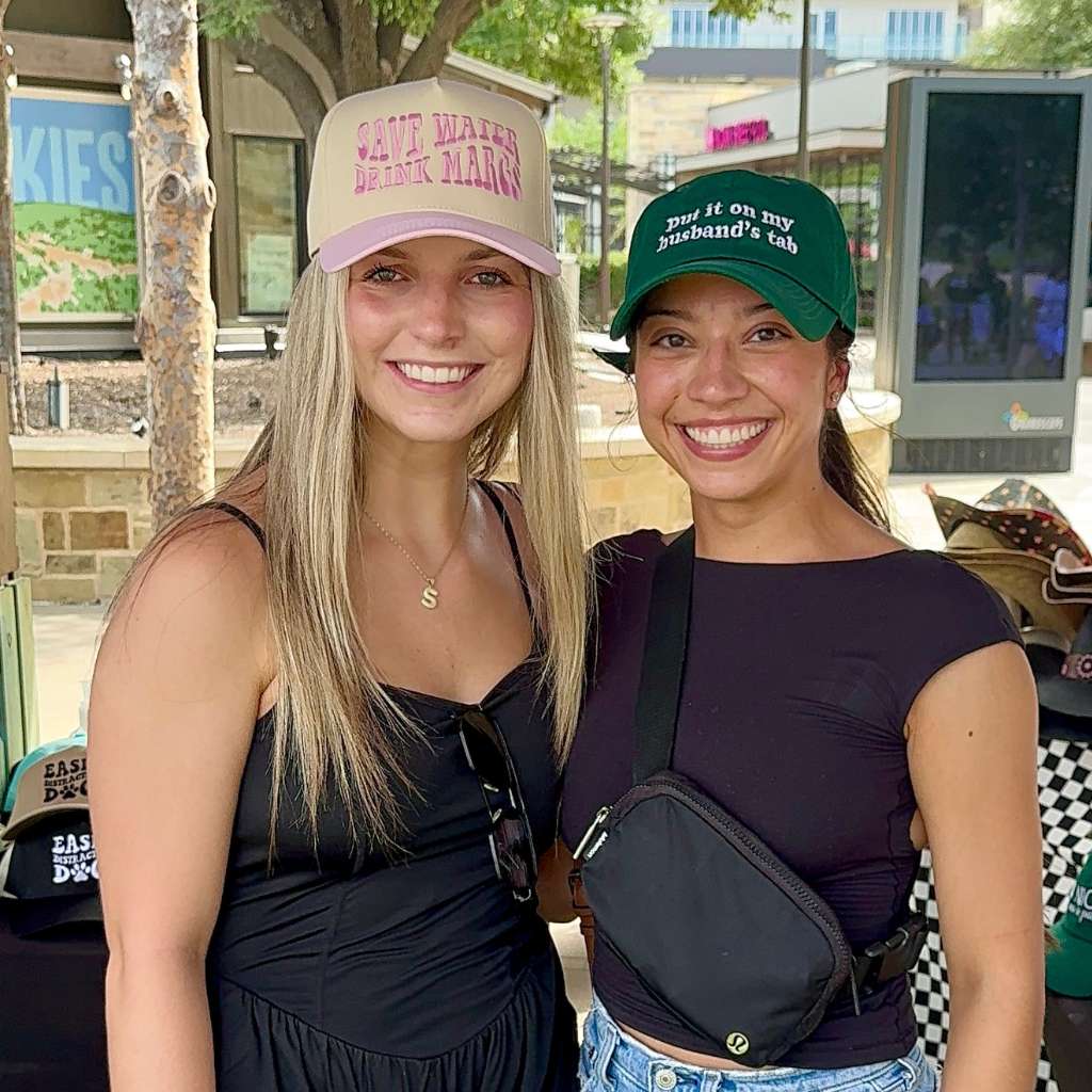 Women wearing baseball statement hats