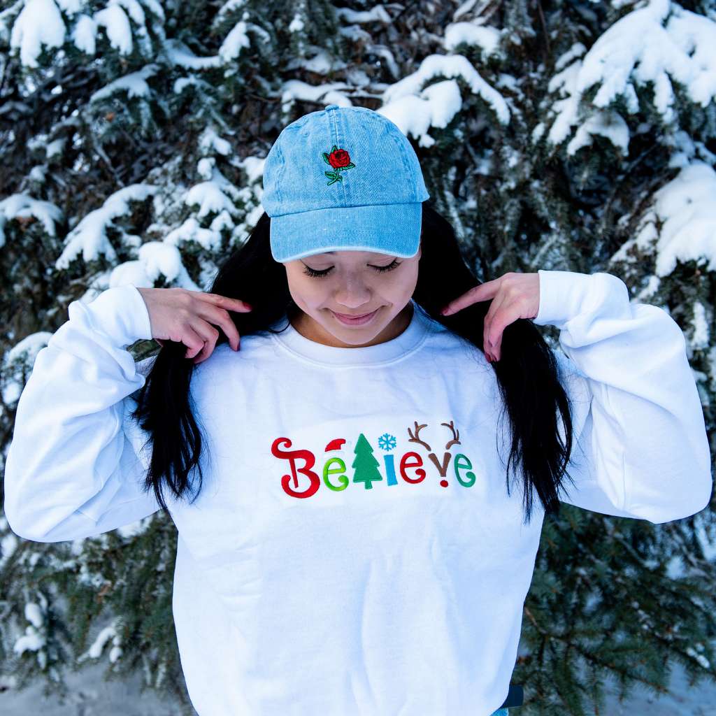Red embroidered Merry Christmas T-shirt and a white t-shirt embroidered with a Christmas Tree