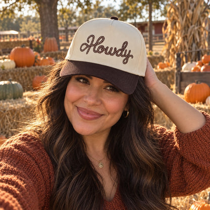Woman at a Texas pumpkin patch wearing the Howdy Rope trucker hat in Natural / Brown Bill