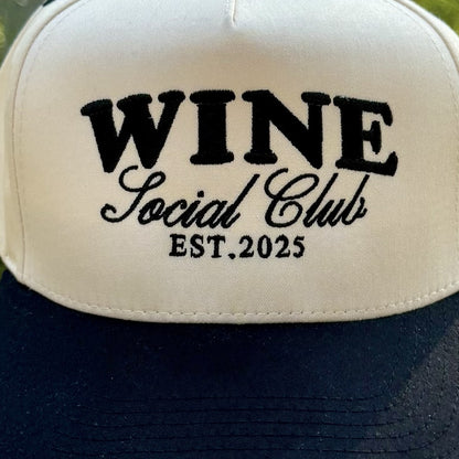 Close-up of the black embroidered lettering on the front of the Wine Social Club trucker hat